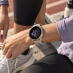 GARMIN Forerunner 970 GPS Running Smartwatch Soft Gold Titanium with French Grey Case and French Grey/Translucent Indigo Band 10-02969-12 view 4